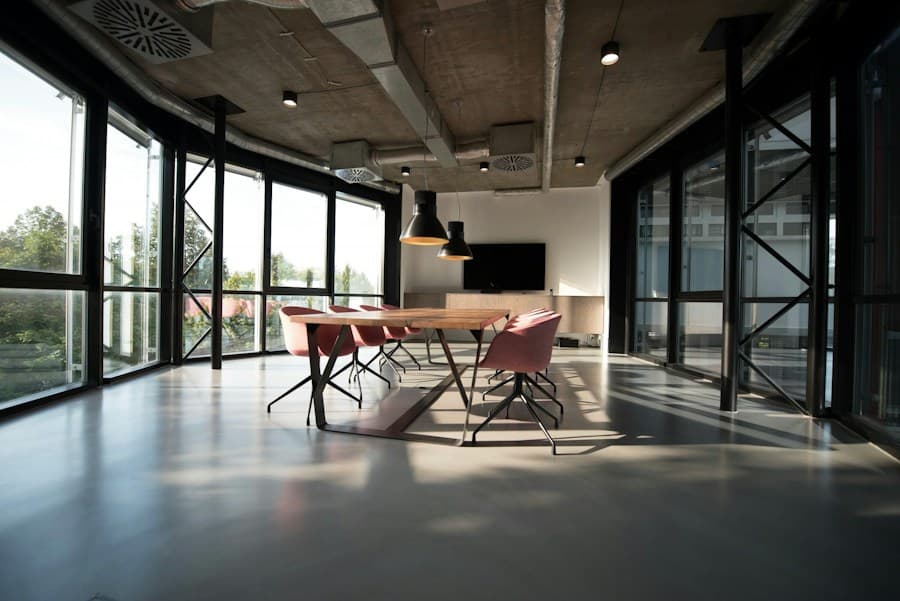 A welcoming, sunlit workspace with a large shared table and green plants